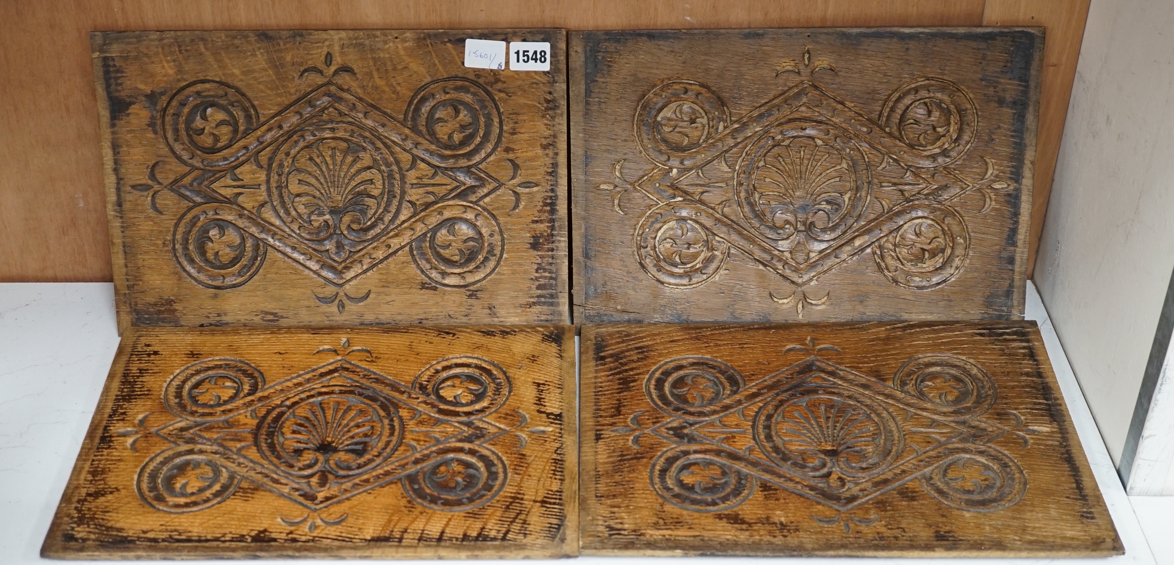 A set of four 18th century carved oak panels, 37cm x 25cm. Condition - two have splits